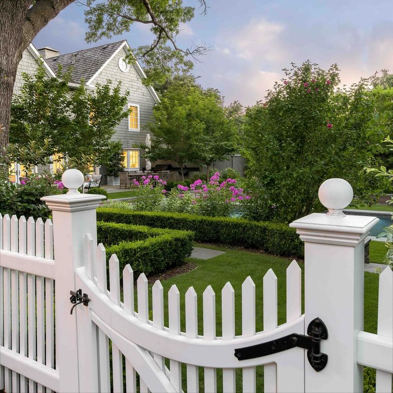 White Picket Fence With Hedges