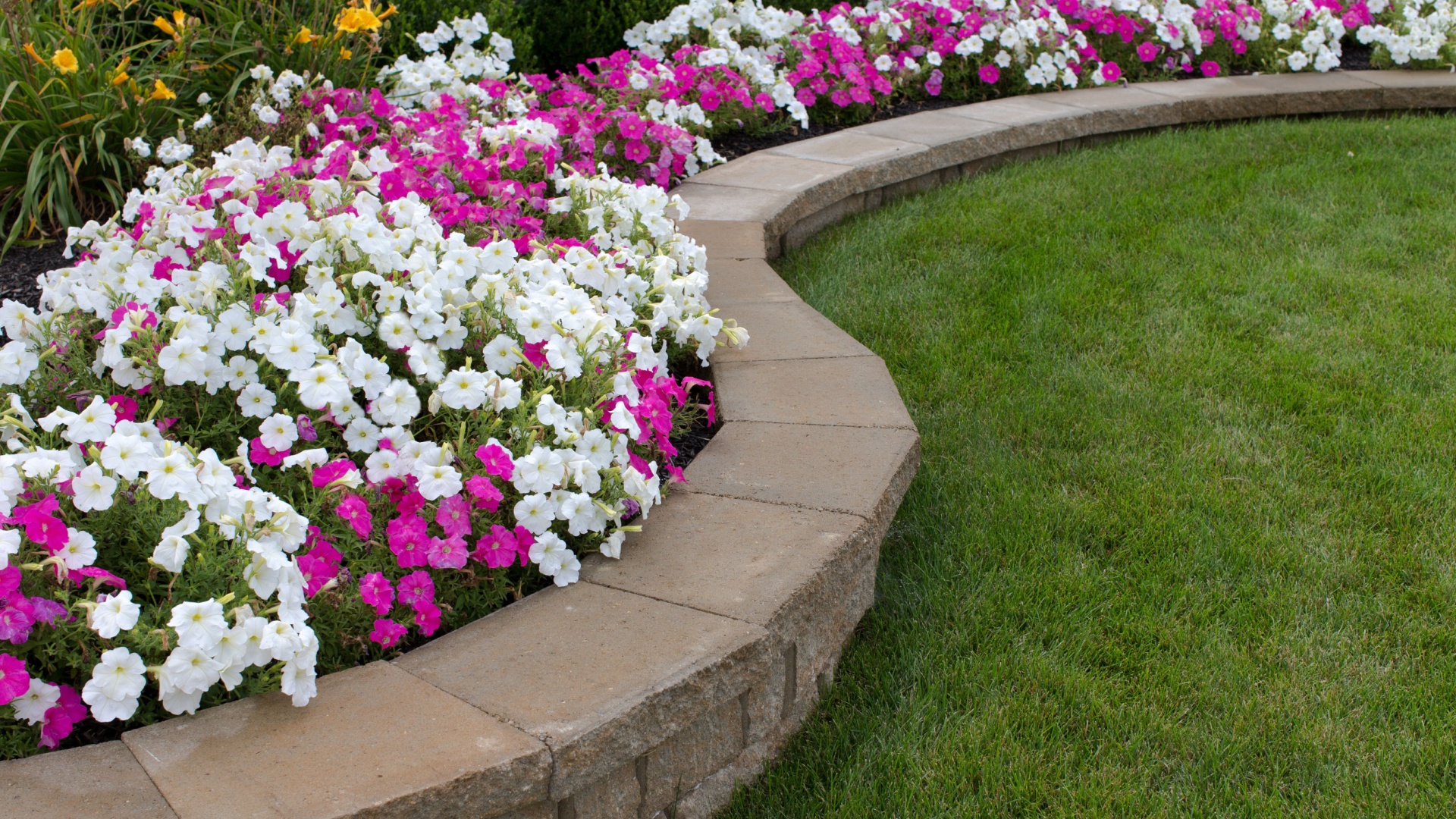17 Genius Ways To Keep Grass Out Of Your Flower Beds—For Good
