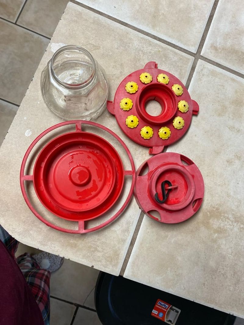Scrub Feeding Ports With Old Toothbrush