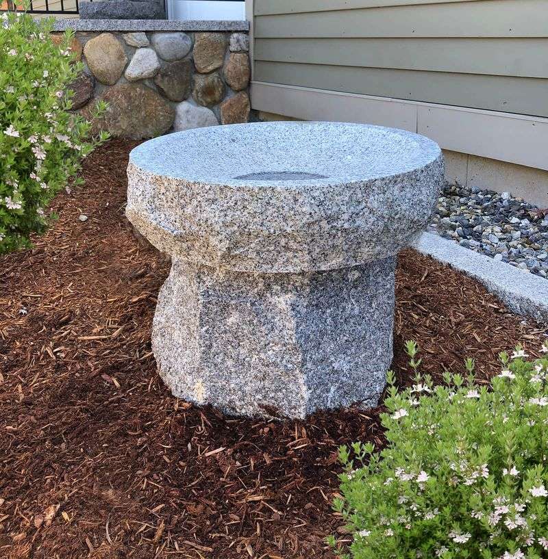 Granite Millstone Bath With Catmint Border