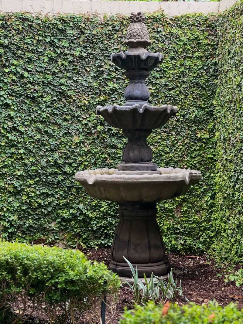 Tiered Concrete Fountain With Daylilies
