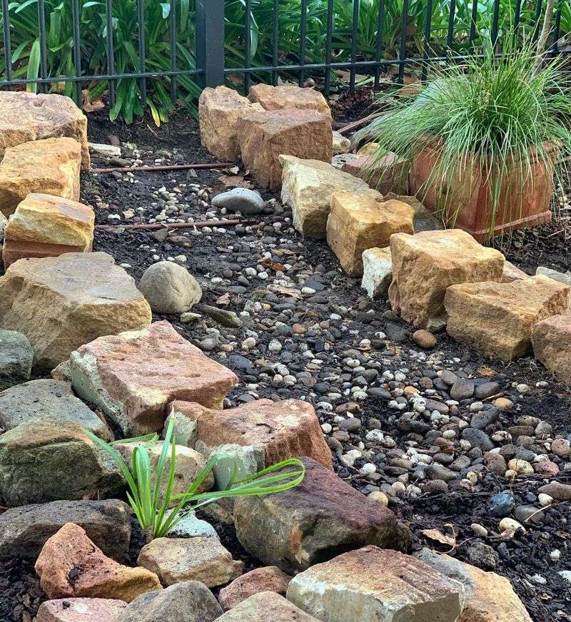 Salvaged Rocks Create Free Drainage Solutions