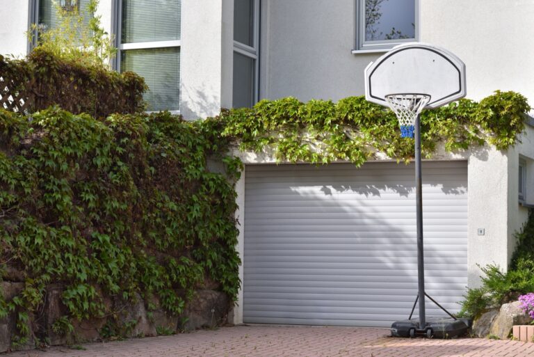 basketball hoop installed next to a garage