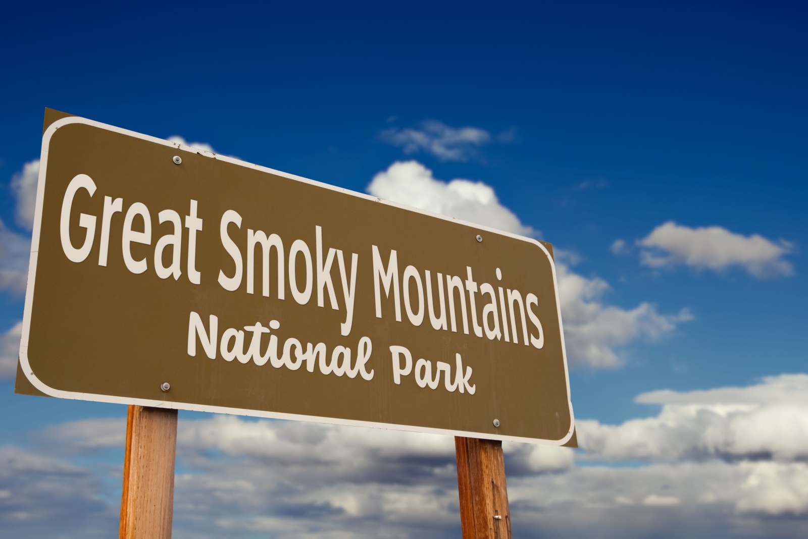 Great Smoky Mountains National Park Road Sign (Tennessee, North Carolina) Against Blue Sky and Clouds