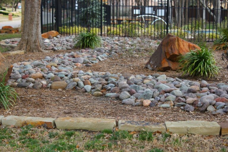 Landscaped garden with river rocks and decorative rocks