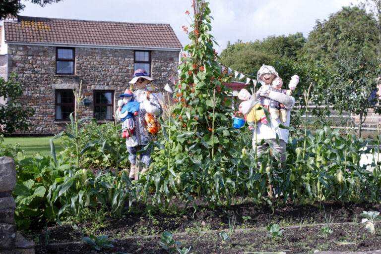 scarecrow family in the garden (featured image)