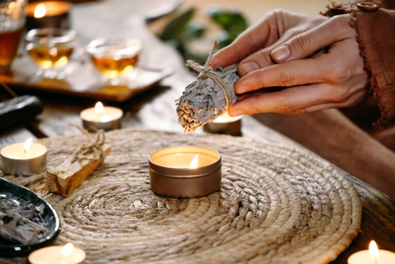 Woman hands burning white sage