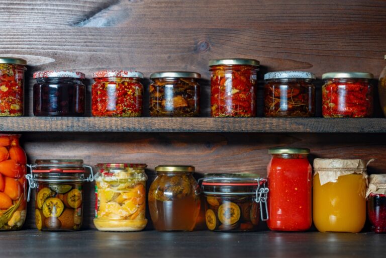 ood in glass jars on wooden shelves in the OlegD cellar for winter