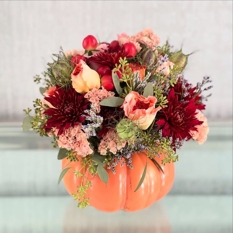 Carved Pumpkin Vase with Fresh Mums