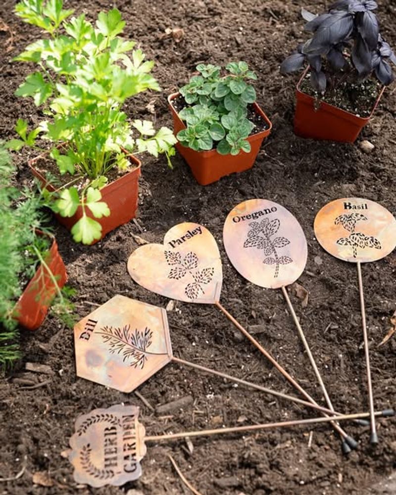 Wooden Signs Staked In Flower Beds