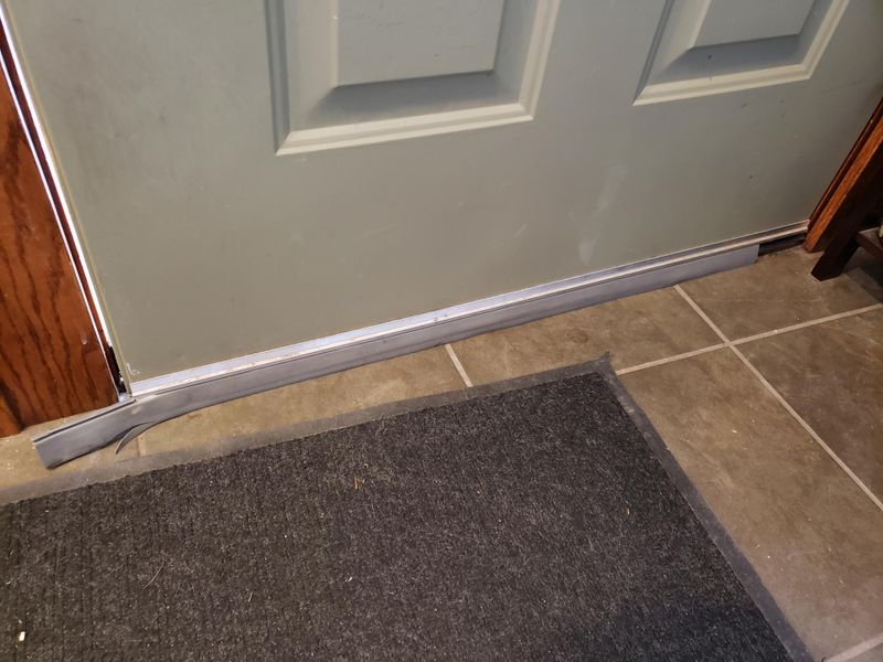 Install Door Sweeps and Weather Stripping