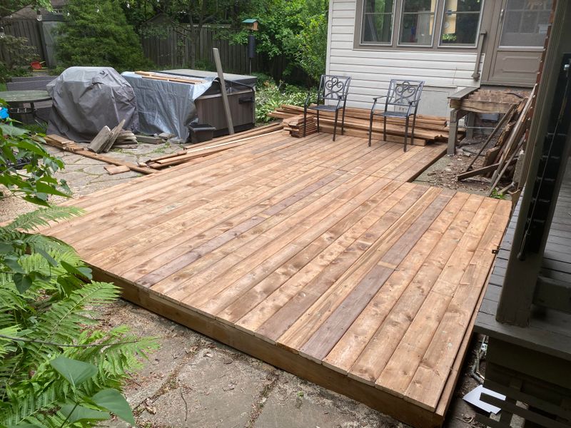 Applying Protective Sealant to Wooden Decks