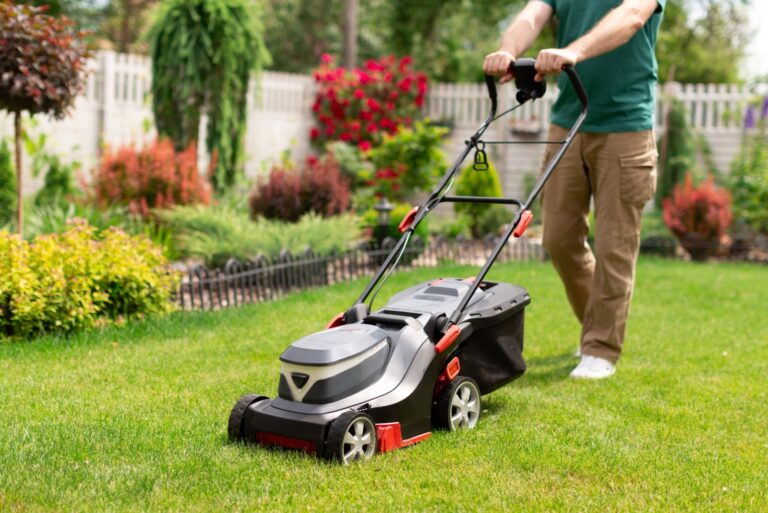 Close-up of man with lawn mower