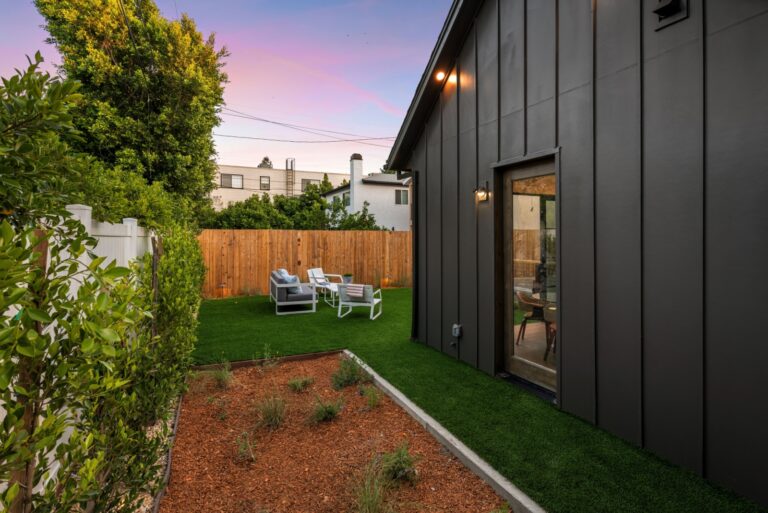Modern backyard with artificial grass,
