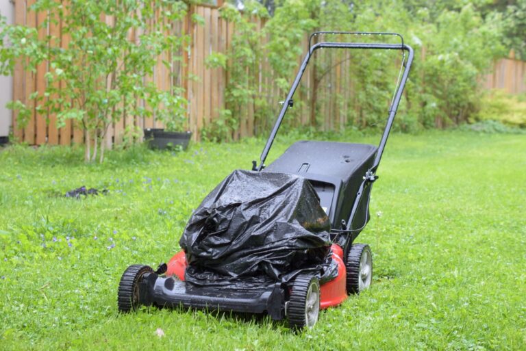 Lawn mower parked outside in the rain