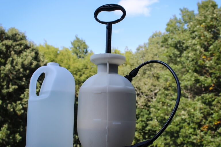 garden sprayer and a container of liquid