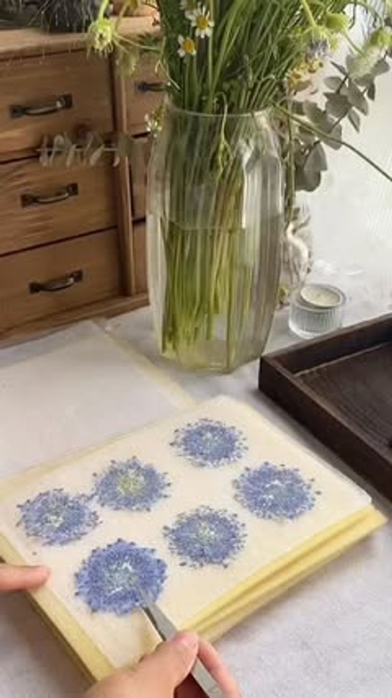 Pressing Flowers Between Heavy Books