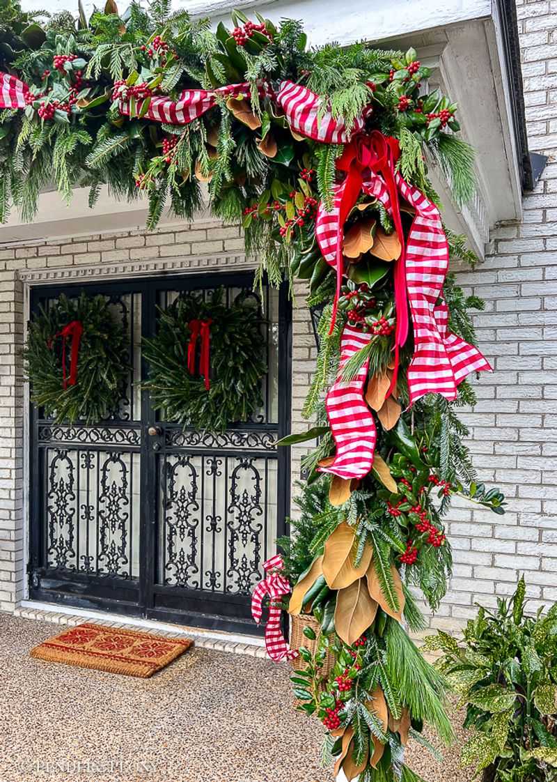 Fresh Evergreen Garlands Draped Over Gates