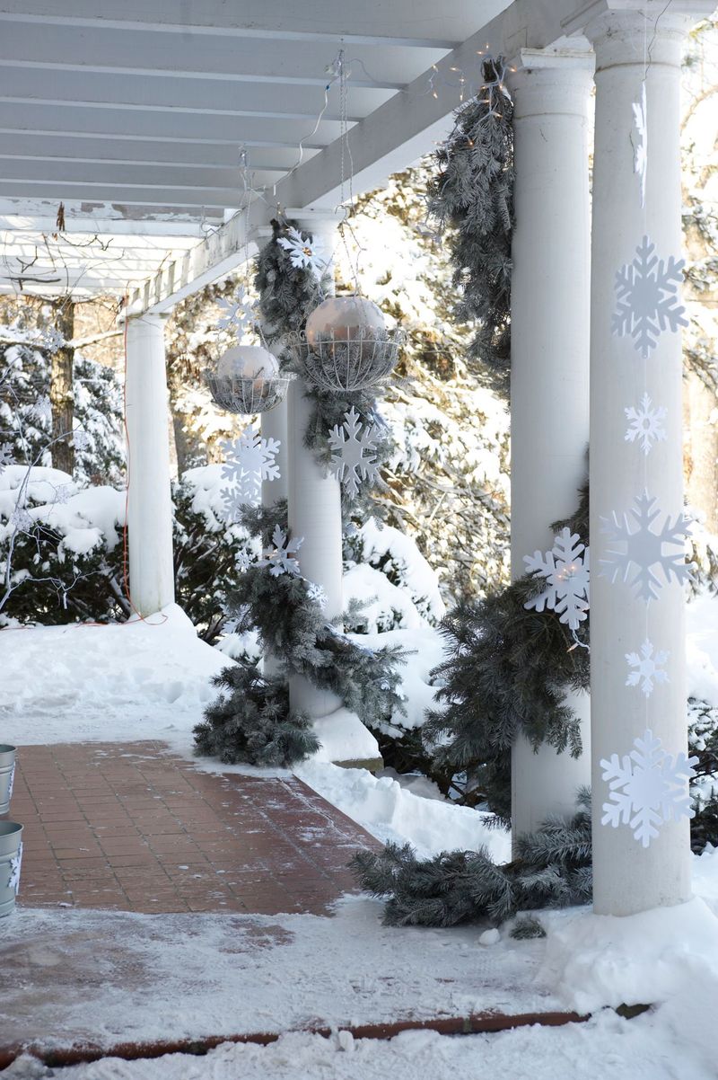 Rustic Cedar Posts Wrapped In Evergreens