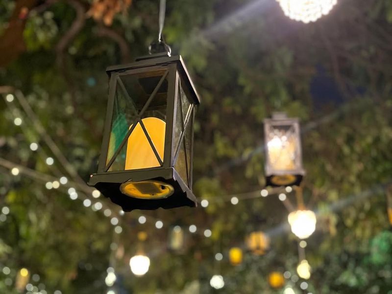 Hanging Lanterns With Evergreen Swags
