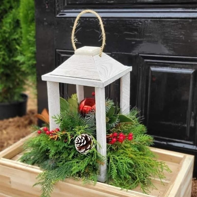 Lanterns Nestled Among Evergreen Boughs
