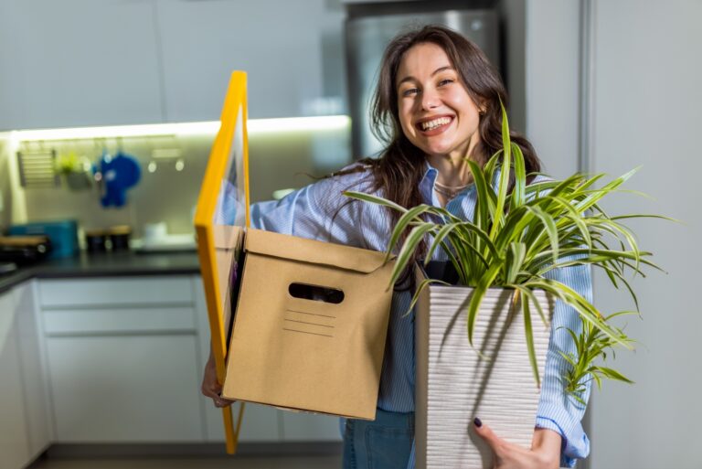 cheerful woman holding a plant