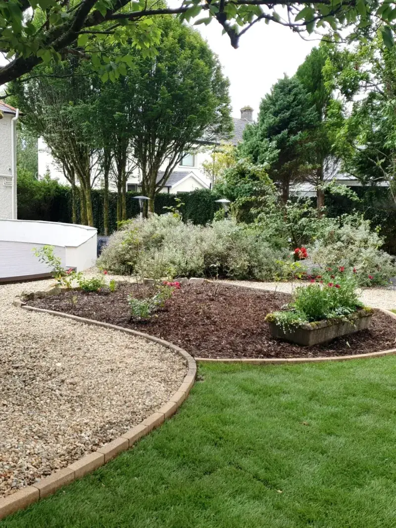 Add A Curved Mulch Bed To Break Up Large Lawn Areas