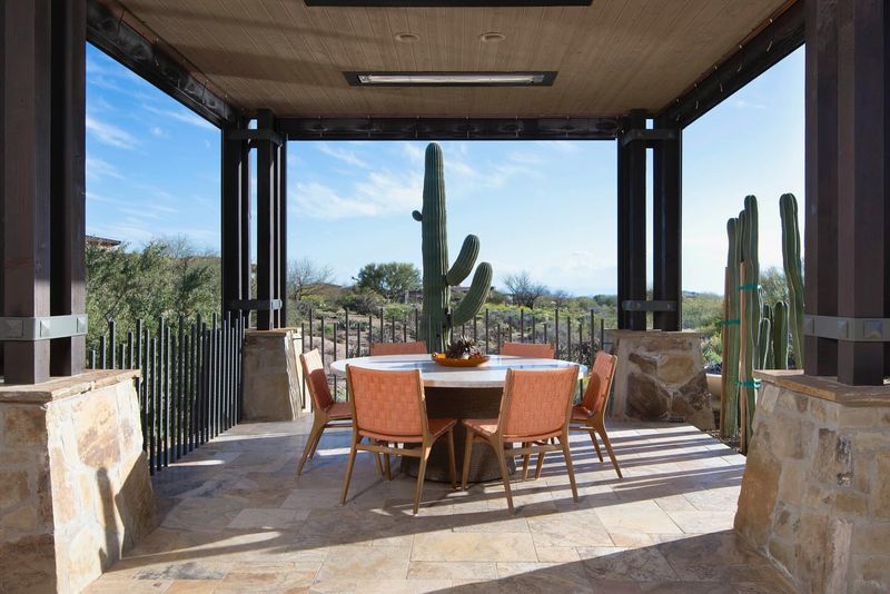 Create A Small Shaded Seating Spot With Two Chairs And A Side Table