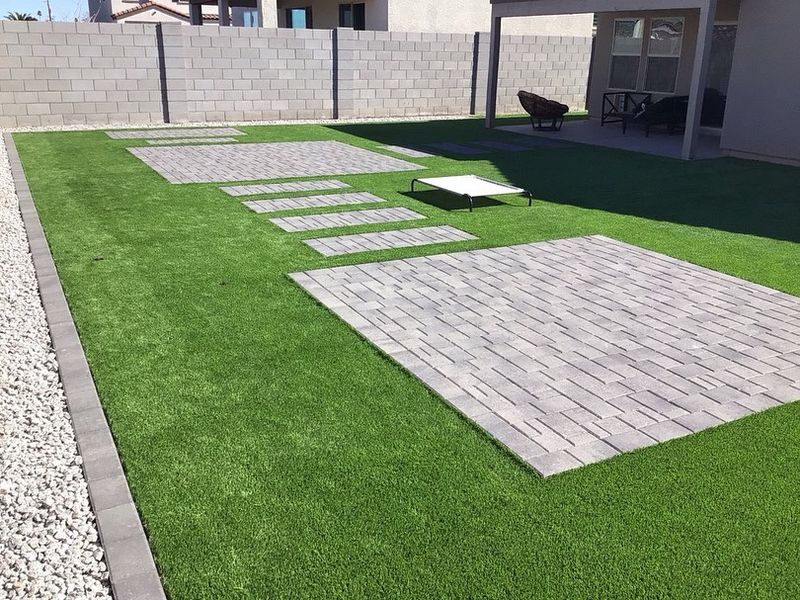Artificial Turf Replaces Gravel With Cooler Low Maintenance Areas