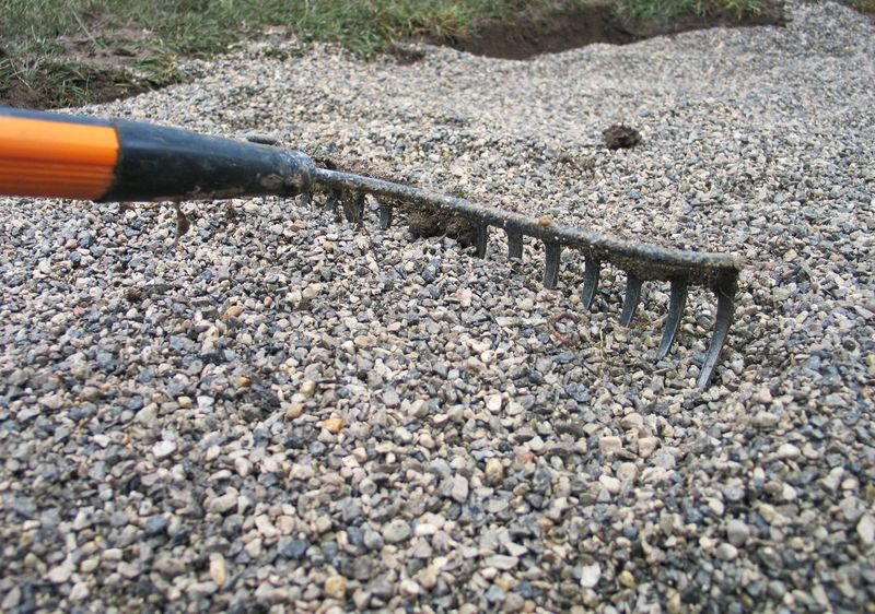 Rake Low Spots Before Adding New Gravel