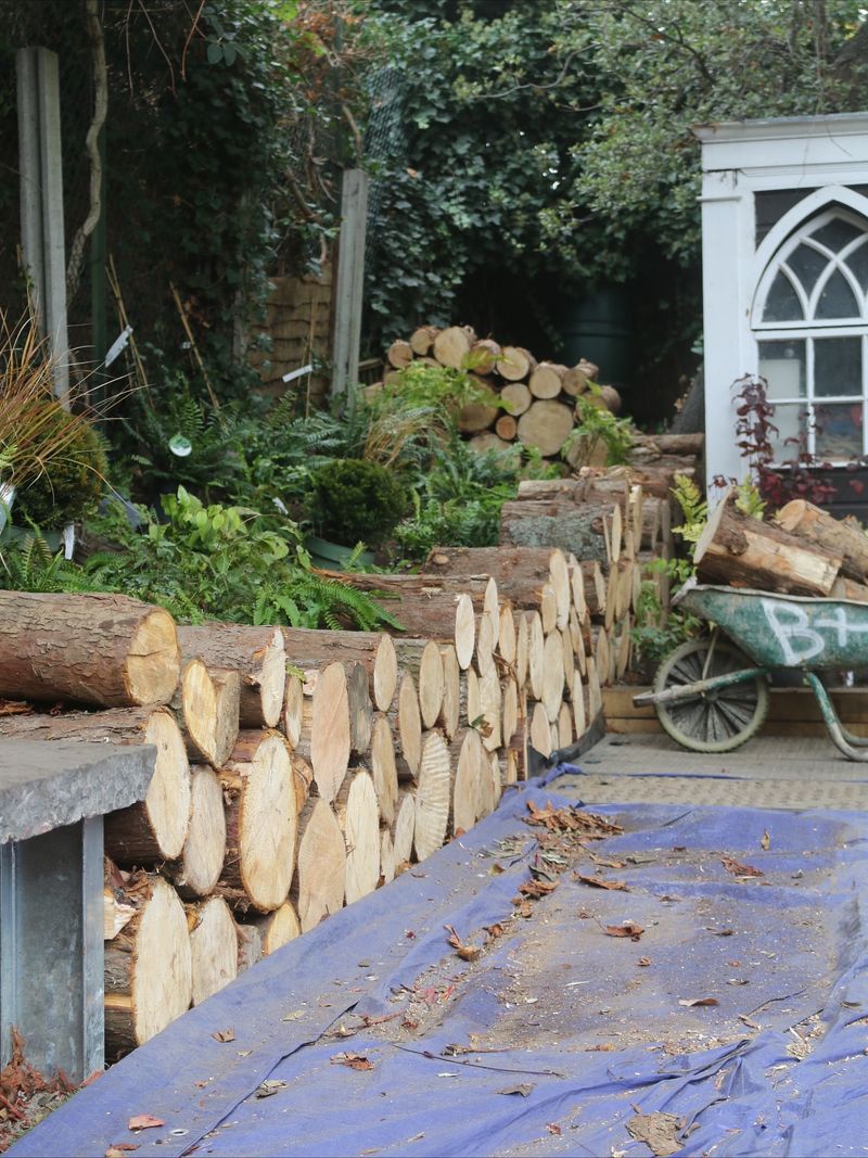 Wood Piles And Stone Piles Beside Foundations