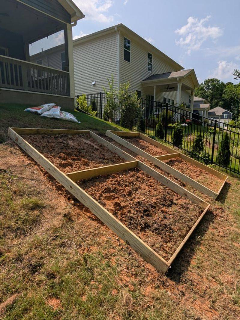 Level Sloped Beds Before Mulching Level Sloped Beds Before Mulching