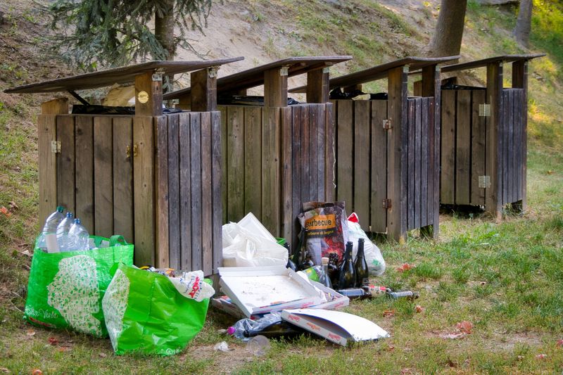 Overflowing Trash Bins Near Porches Add Appeal
