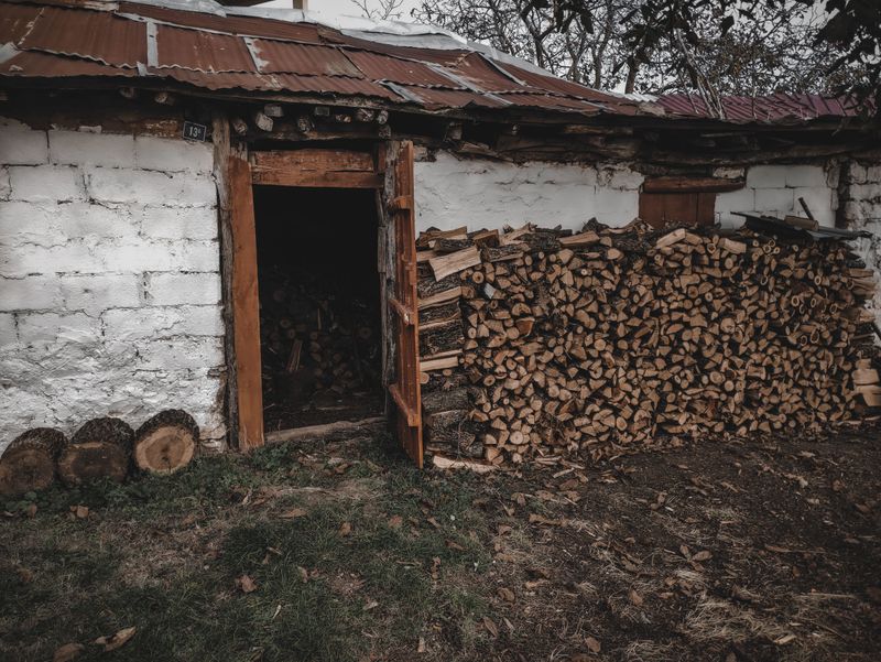 Woodpiles Stacked Near The House
