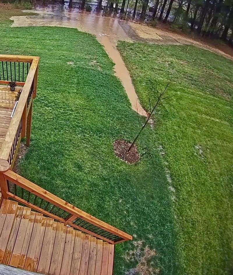 A Downhill Yard Pushes Stormwater Toward Basement Walls A Downhill Yard Pushes Stormwater Toward Basement Walls