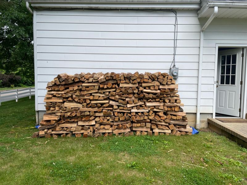 Firewood Stacked Against The House Firewood Stacked Against The House