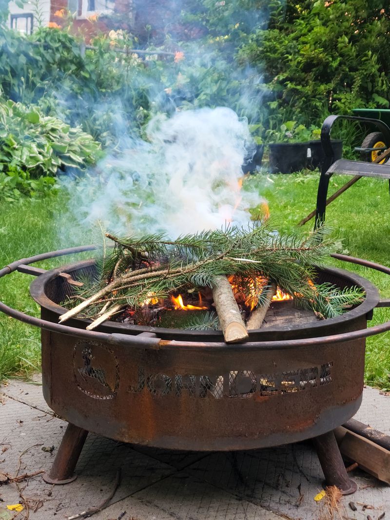 Tossing Rosemary Bundles On Backyard Fire Pits Tossing Rosemary Bundles On Backyard Fire Pits